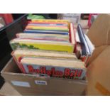 A box containing a quantity of children's annuals