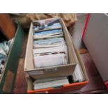 Two boxes containing postcards