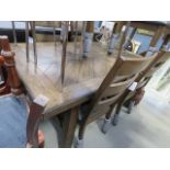 A dark wood extending dining table, plus six matching chairs