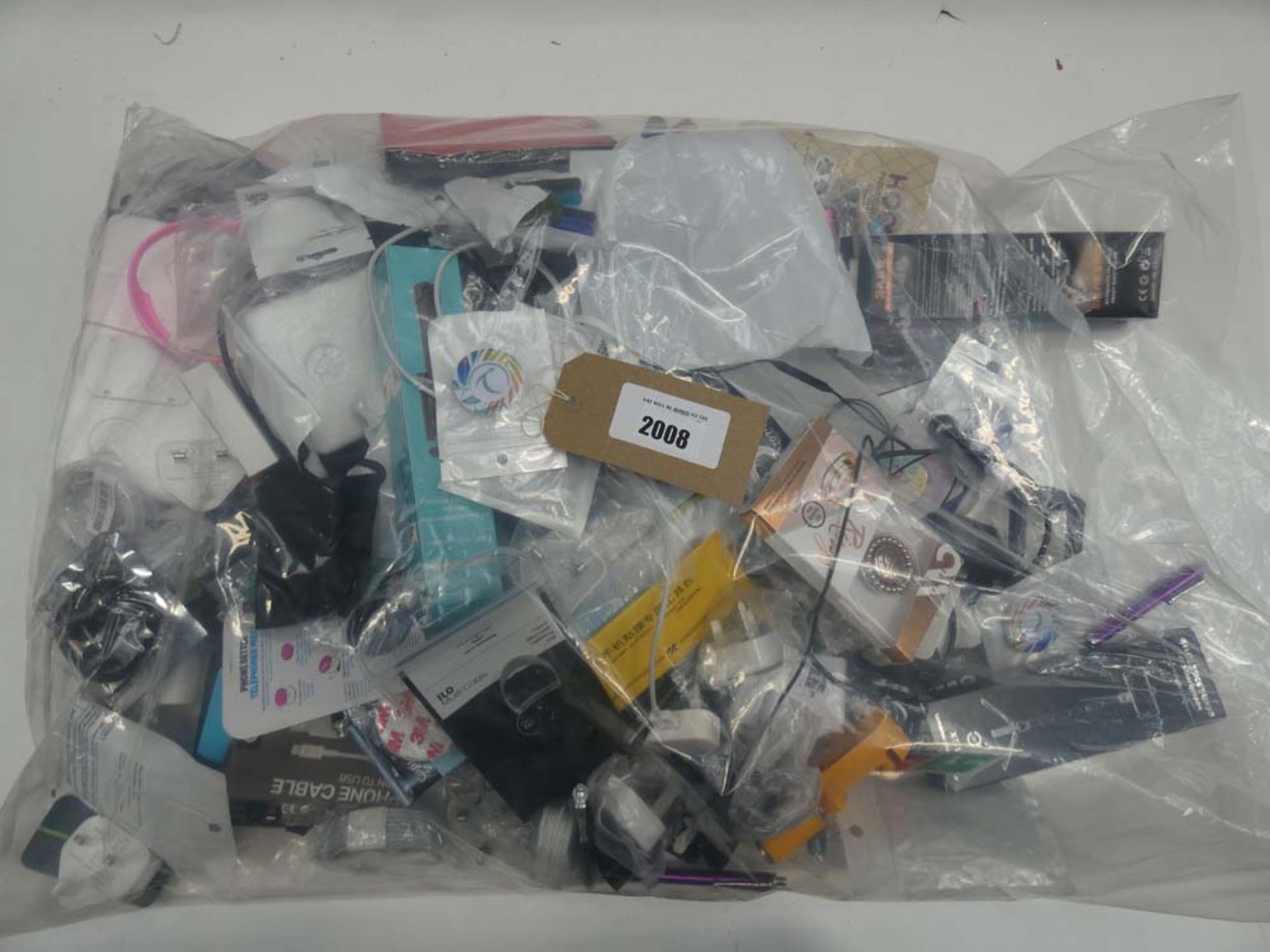 Bag containing quantity of mobile phone accessories; cables, adapters, selfie sticks, power banks,