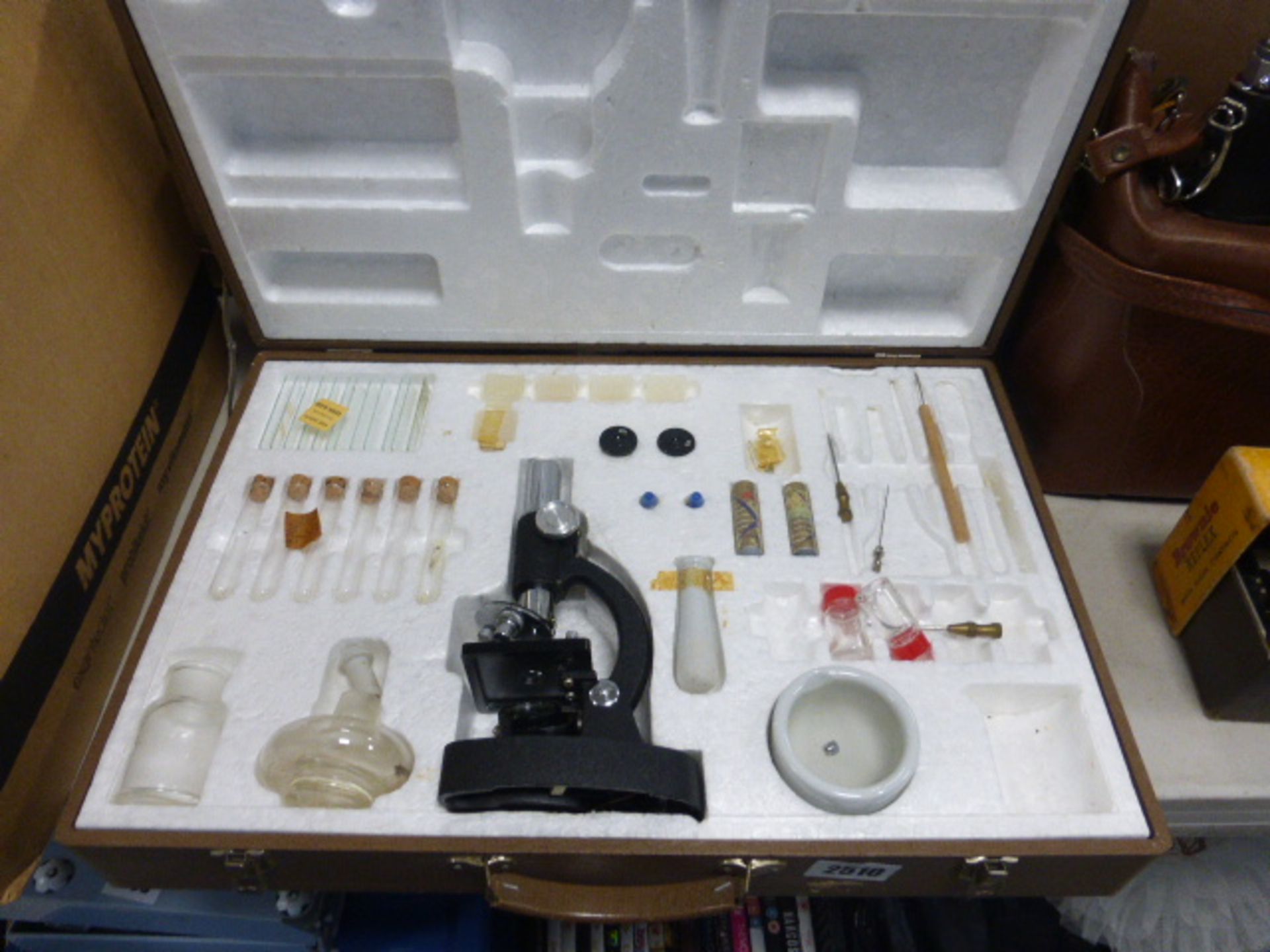 Scientific microscope set in carry case