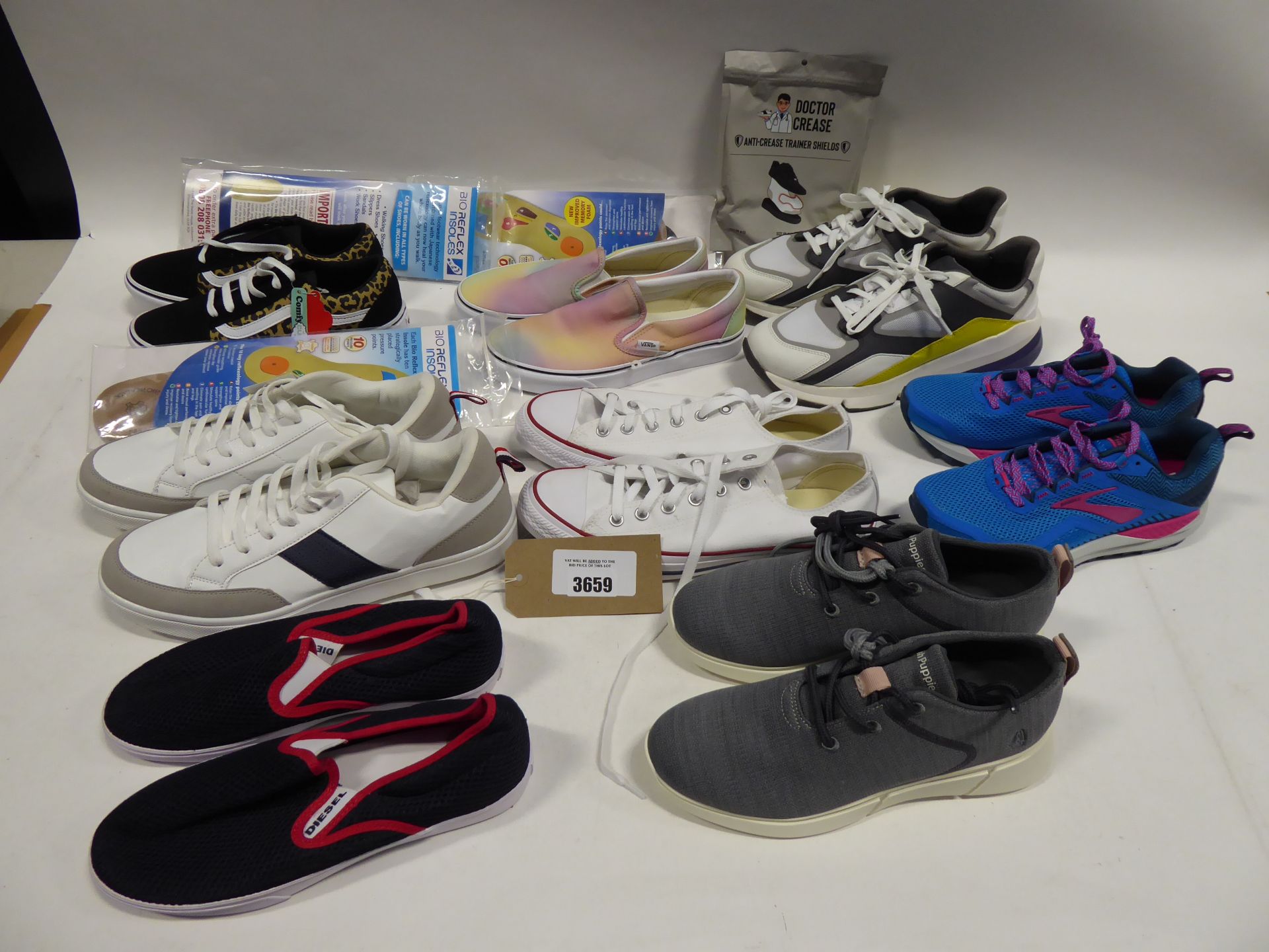 Bag of assorted trainers and footwear accessories