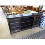 Black painted open fronted bookcase with glazed doors to the side