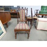 A carved walnut chair with embroidered seat and back rest