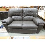 A brown leather effect two seater sofa