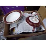 Two boxes containing a quantity of mid winter maroon and gold rimmed crockery