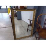 Rectangular beveled mirror in guilt frame