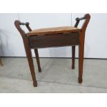 An Edwardian mahogany inlaid piano stool with hinged seat