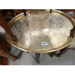 Circular brass tray table on folding base