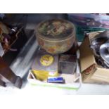 Box containing vintage tins