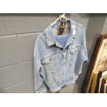 Pair of denim trousers jacket and belt