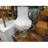 5238 - A florally decorated pottery table lamp with shade