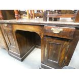 A dark oak kneehole desk