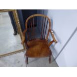 Elm seated stick back armchair as found