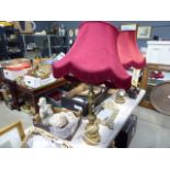 2 ornate brass table lamps with red fabric shades