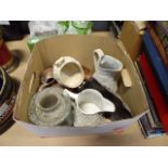 Box containing pottery metal water jugs