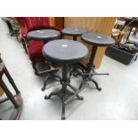 Four wrought iron pub stools