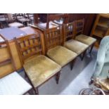Four Edwardian oak dining chairs with upholstered seats
