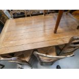 Oak dining table with 6 rush seated chairs