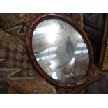 Oval mirror in faux walnut frame