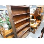 An open fronted pitched pine bookcase