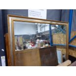 Large rectangular bevelled mirror in silver and gilt frame