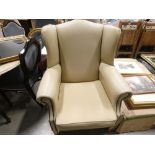 5461 - Cream leather effect wingback armchair