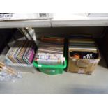 Three boxes containing vinyl records