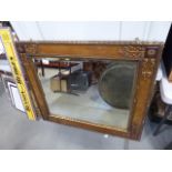 Large rectangular bevelled mirror in decorative gilt frame