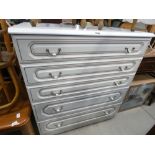 A white painted chest of five drawers