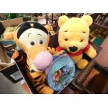 Box containing a toy Winnie the Pooh and Tigger plus a plate