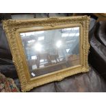 Rectangular mirror in ornate gilt frame