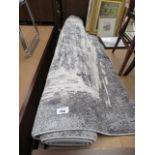 Large grey and beige mottled rug