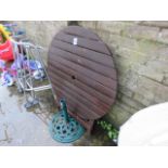 Folding wooden table and a parasol base