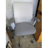 Vitra grey upholstered swivel office armchair on 5 star metal base