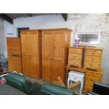 Modern pine bedroom suite comprising pair of double door wardrobes, pair of 4 drawer chests, pair of