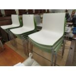 15 green and white stackable chairs by arper