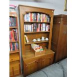 Dark oak open front bookcase with covered storage below