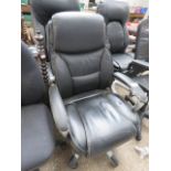 Black leatherette upholstered swivel office armchair (well worn)