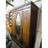 Dark oak triple fronted wardrobe with oval bevelled mirror