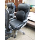 Black leatherette upholstered swivel office armchair