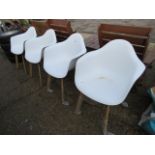 4 white outdoor dining chairs with wooden legs