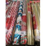 3 rolls of Christmas wrapping paper