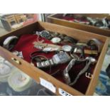 Shallow tray containing mixed watches