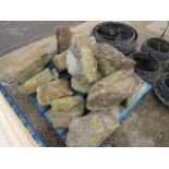 Pallet containing garden boulders