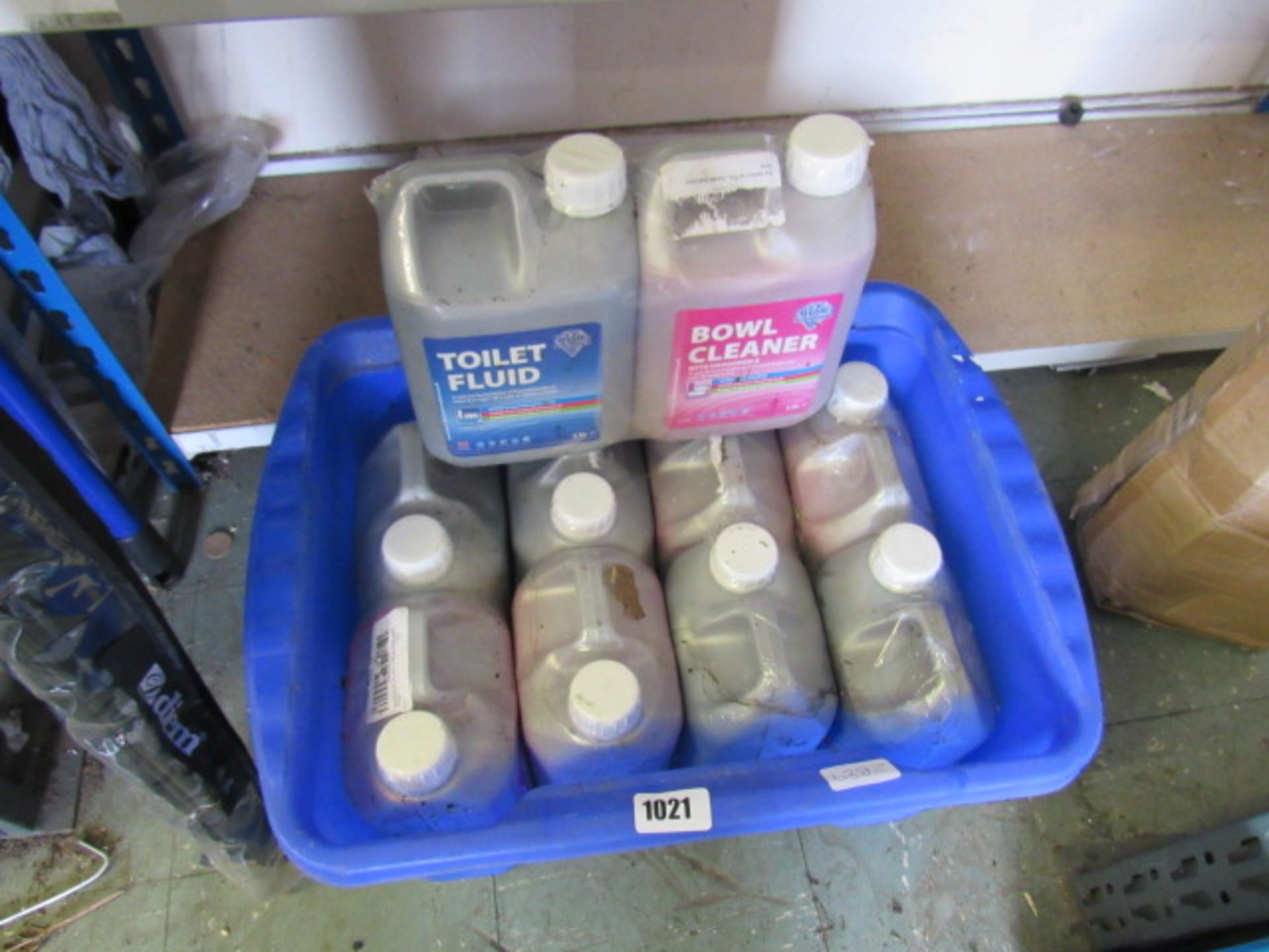 Box containing toilet fluid and bowl cleaner