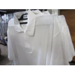 Quantity of white polo shirts