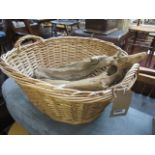 Twin handled wicker basket with 2 pieces of drift wood