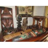 Collection of carved wooden masks, small stool and other African ornaments