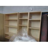 Maple finish open bookcase and pair of narrow matching bookcases